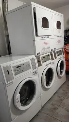 two washing machines are sitting next to each other at maison village vacances demeures du Ventoux in Aubignan