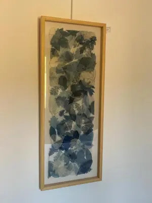 a painting of flowers hanging on a wall at lagalerie84 in Saint-Saturnin-les-Apt