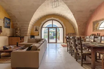 a living room with a couch and a table at Errances Provençales in Saint-Rémy-de-Provence