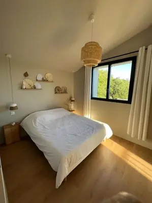 a bedroom with a white bed and a window at Villa des Mattes - Superbe maison de famille 15 couchages in Crillon-le-Brave