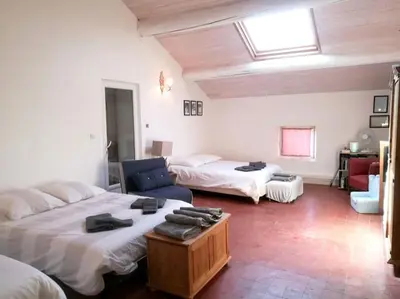 a bedroom with two beds and a skylight at Maison de 6 chambres avec piscine privée, jardin aménagé et wifi à Pernes-les-Fontaines in Pernes-les-Fontaines