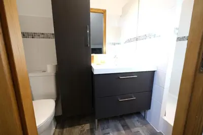 a bathroom with a sink and a toilet and a mirror at magnificent individual villa with heated swimming pool, in aureille, in the alpilles - 10 persons in Aureille