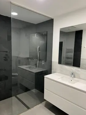 a bathroom with a sink and a shower and a mirror at Villa Design in Bédoin