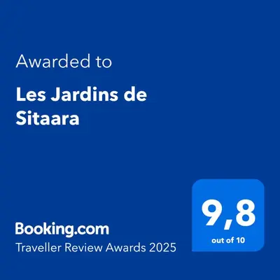 a screenshot of a phone with the text awarded to las jardins de st at Les Jardins de Sitaara in Cucuron