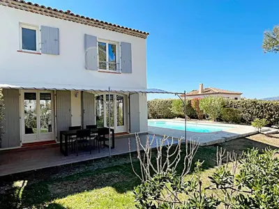 a villa with a swimming pool and a house at Golf de Pont Royal Villa des Alpilles climatisée 3 chambres Piscine chauffée Parking et Garage in Mallemort