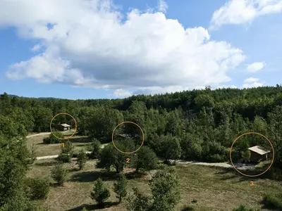 an overhead view of a field with trees in the background at La Grisonne - Gîte Nordine in Revest-du-Bion