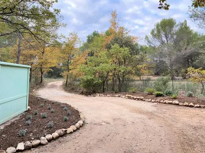 a dirt road with rocks on the side of it at Le domaine de Gaïa in Aix-en-Provence