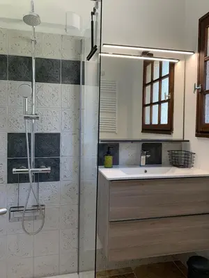 a bathroom with a shower and a sink and a shower at Gîte La loge 142 route de CARPENTRAS 84210 VENASQUE in Venasque