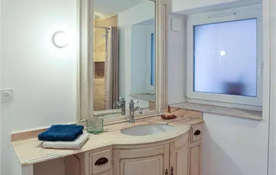 a bathroom with a sink and a mirror at Stunning Apartment In Villes Sur Auzon in Villes-sur-Auzon