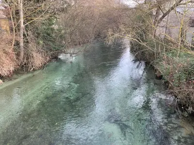 a view of a river from a bridge at Clos du Cardinal avec piscine in LʼIsle-sur-la-Sorgue