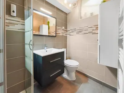 a bathroom with a toilet and a sink at L'Isle d'Or - La Nuit Etoilée in LʼIsle-sur-la-Sorgue