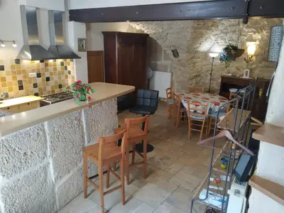 a kitchen and dining room with a table and chairs at La Mauricette - free Parking & Cancellation - WiFi in Pélissanne