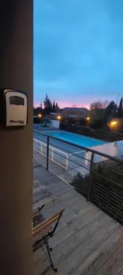 a balcony with a view of a swimming pool at 107 Paisible et unique avec terrasse sur vue piscine in Éguilles