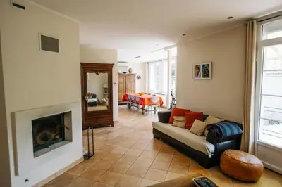a living room with a couch and a fireplace at Villa Balleti - private pool with a view in Apt