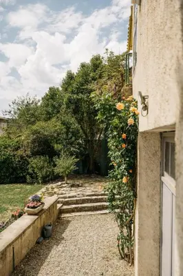 an entrance to a house with stairs and flowers at Villa Balleti - private pool with a view in Apt