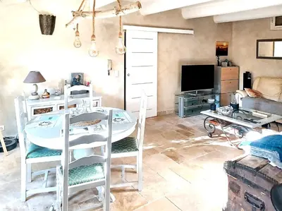 a living room with a white table and chairs at Appartement spacieux à Aix-en-Provence 100 m² avec hammam in Aix-en-Provence