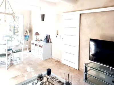 a living room with a fireplace and a tv at Appartement spacieux à Aix-en-Provence 100 m² avec hammam in Aix-en-Provence