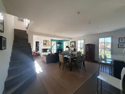 a living room with a table and a dining room at Lou Pantai, House, 5 bedrooms, 8 people, AC, Pool, Large garden,4km from AIX EN PROVENCE in Aix-en-Provence