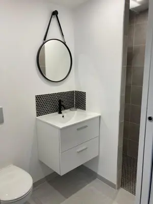 a bathroom with a white sink and a mirror at La Manuia in Ventabren