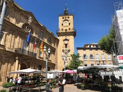 a clock tower in the middle of a building at Aix Homes 
