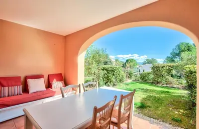 a living room with a table and chairs and a couch at Village Pont Royal en Provence - maeva Home - Appartement cosy et climatisé 2 pièces 5 personnes avec jardin - Prestige - super Home MAE-2864 in Mallemort