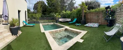a backyard with a swimming pool in the grass at Luxury House Family’s in Carpentras