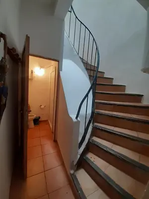 a hallway with a stairway leading to a room at Apt en Luberon appartement 3 chambres et garage privée in Apt