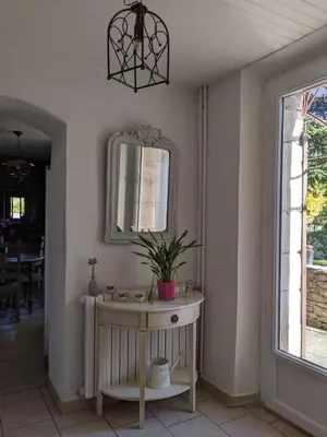 a bathroom with a sink and a mirror on the wall at Mas dans les lavandes in Ménerbes