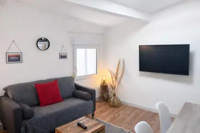 a living room with a couch and a flat screen tv at 