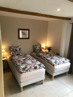 two beds sitting next to each other in a bedroom at Campagne de Saint Clair in Pertuis