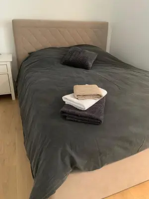 a bed with two towels and two pillows on it at Joli studio centre village in Lambesc