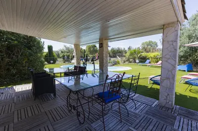 a patio with a table and chairs on it at Gîte Petit Luberon chez Manon en Luberon - Vacation rental in guest house in Lagnes