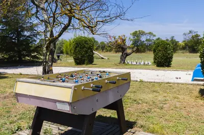a foosball table sitting in a field with at Gîte Petit Luberon chez Manon en Luberon - Vacation rental in guest house in Lagnes