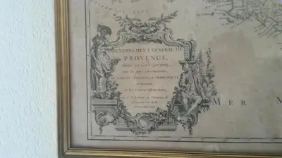 a picture in a frame hanging on a wall at Centre d'Aix - charmant appartement 1 chambre Pythagore avec parking in Aix-en-Provence