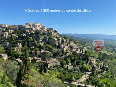 a city on a hill with houses at In Gordes, facing the entire Luberon Park a beautiful 5 bedrooms house in Gordes