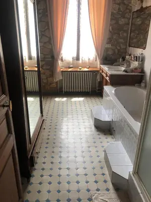 a bathroom with a tub and a sink at Chez Fleur in Avignon
