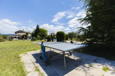 a ping pong table in the middle of a yard at Gite Grand Luberon chez Manon en Luberon - Vacation rental in guest house in Lagnes