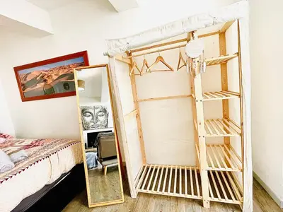 a bedroom with a mirror next to a bed at *Le Sahara*Hyper Centre*Wifi* in Salon-de-Provence