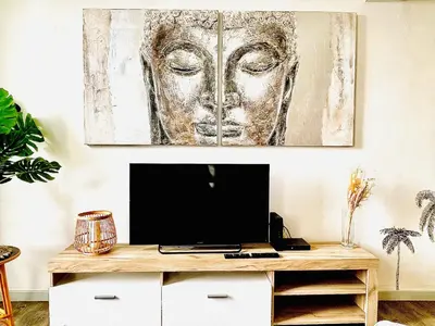 a living room with a desk with a television on it at *Le Sahara*Hyper Centre*Wifi* in Salon-de-Provence