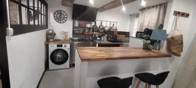 a kitchen with a counter and a stove top oven at LA JOVINE 2 Sault in Sault-de-Vaucluse