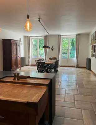 a large living room with a table and chairs at Bastide Sainte Marie in Mallemort