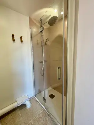 a shower with a glass door in a bathroom at Beau studio au cœur d’Aix et du Cours Mirabeau in Aix-en-Provence