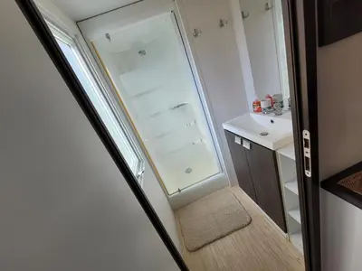 a small bathroom with a walk in shower next to a sink at Chez Coralie in La Roque-dʼAnthéron