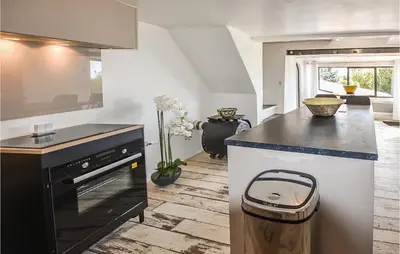 a kitchen with a black and white counter top at Gorgeous Home In Sault in Sault-de-Vaucluse
