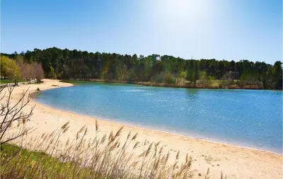 a large pool of water on a sandy beach at Gorgeous Home In Sault in Sault-de-Vaucluse