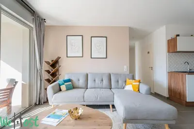 a living room with a couch and a table at Superb Apartment - Downtown Aix-en-Provence in Aix-en-Provence