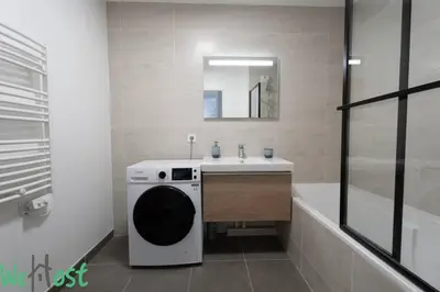 a bathroom with a sink and a washing machine at Superb Apartment - Downtown Aix-en-Provence in Aix-en-Provence