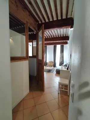a hallway in a house with a living room at CORDELIERS MAIRIE in Aix-en-Provence